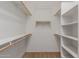 Walk-in closet with lots of storage with multiple shelves and racks at 17517 W Dahlia Dr, Surprise, AZ 85388