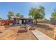 Backyard oasis features a covered patio, fire pit, and potential for outdoor gatherings and relaxation at 20816 E Duncan St, Queen Creek, AZ 85142