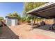 The spacious backyard features a shed and covered patio perfect for entertaining or relaxing at 20816 E Duncan St, Queen Creek, AZ 85142
