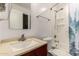 This well-lit bathroom features a clean design with a shower-tub combination and modern fixtures at 20816 E Duncan St, Queen Creek, AZ 85142