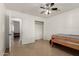The bedroom features tile flooring for low maintenance, a built-in closet, and a sunny window at 20816 E Duncan St, Queen Creek, AZ 85142