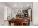 The open-concept kitchen features sleek stainless steel appliances and a seamless flow into the adjacent dining area at 20816 E Duncan St, Queen Creek, AZ 85142