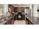 Well-equipped kitchen features granite countertops, stainless steel appliances, and modern cabinetry at 20816 E Duncan St, Queen Creek, AZ 85142