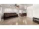 Bright living room with tile flooring, ceiling fan, and views of an open dining area and bar seating at 20816 E Duncan St, Queen Creek, AZ 85142