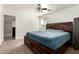 The spacious main bedroom offers a comfortable retreat with a ceiling fan and an abundance of natural light at 20816 E Duncan St, Queen Creek, AZ 85142