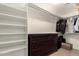 Ample storage and organization are the highlights of this closet with custom shelving and plenty of room for wardrobe at 20816 E Duncan St, Queen Creek, AZ 85142