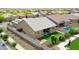 Aerial view of a home with a backyard featuring artificial grass, a patio, and mature landscaping at 23871 N 167Th Ln, Surprise, AZ 85387