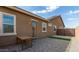 This backyard features a paved patio area and outdoor lighting at 23871 N 167Th Ln, Surprise, AZ 85387
