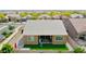 This home has a cozy backyard with a patch of artificial turf and a gravel area at 23871 N 167Th Ln, Surprise, AZ 85387