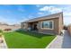 Large backyard features a lush lawn, perfect for outdoor activities and relaxation at 23871 N 167Th Ln, Surprise, AZ 85387