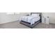 A cozy bedroom with natural light, complemented by a simple bed and a dresser at 23871 N 167Th Ln, Surprise, AZ 85387