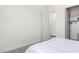 Serene bedroom featuring soft carpeting, neutral walls, and access to laundry and closet at 23871 N 167Th Ln, Surprise, AZ 85387