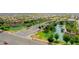 Aerial view of the community entrance, showcasing its beautiful landscaping and water features at 23871 N 167Th Ln, Surprise, AZ 85387