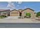 Beautiful single-story home with desert landscaping, two-car garage, and inviting facade at 23871 N 167Th Ln, Surprise, AZ 85387