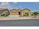 Inviting single-story house featuring a two-car garage and well-kept landscaping at 23871 N 167Th Ln, Surprise, AZ 85387