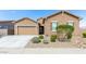 Attractive single-Gathering home with desert landscaping, neutral tones, and a two-car garage at 23871 N 167Th Ln, Surprise, AZ 85387