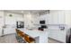 Bright kitchen with white cabinets, a large island, and stainless steel appliances at 23871 N 167Th Ln, Surprise, AZ 85387