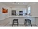 Bright kitchen features white cabinetry, stainless appliances, quartz countertops and a convenient breakfast bar with seating at 23871 N 167Th Ln, Surprise, AZ 85387
