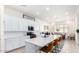 Well-lit kitchen with white cabinetry, stainless steel appliances, and a large island with seating at 23871 N 167Th Ln, Surprise, AZ 85387