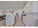 Spacious kitchen with a large center island, white cabinets, and modern appliances at 23871 N 167Th Ln, Surprise, AZ 85387