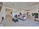 Inviting living room with tile floors, neutral tones, and an open concept layout at 23871 N 167Th Ln, Surprise, AZ 85387
