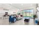Bright living room offering modern decor and plenty of natural light with view to the kitchen at 23871 N 167Th Ln, Surprise, AZ 85387