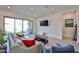 Comfortable living room featuring tile flooring and sliding glass doors leading to the outdoor area at 23871 N 167Th Ln, Surprise, AZ 85387