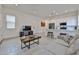 Open-concept living space with tile floors and connection to the bright modern kitchen at 23871 N 167Th Ln, Surprise, AZ 85387