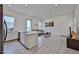 Open-concept living space seamlessly combines a kitchen and living room area, great for gatherings at 23871 N 167Th Ln, Surprise, AZ 85387