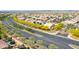 Nice aerial view of a desert community with lush green landscaping and colorful trees at 23871 N 167Th Ln, Surprise, AZ 85387