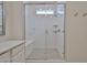 Modern bathroom shower with glass enclosure, bench seat, and horizontal white subway tile at 23871 N 167Th Ln, Surprise, AZ 85387