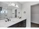 Bathroom boasts dual sinks, modern fixtures, and a walk-in shower at 250 E Barbarita Ave, Gilbert, AZ 85234