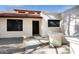 Close up of front entrance showcasing a modern design with a tile roof and desert landscaping at 250 E Barbarita Ave, Gilbert, AZ 85234