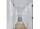Bright hallway with light wood flooring and access to other rooms in the house at 250 E Barbarita Ave, Gilbert, AZ 85234
