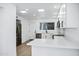 Modern, bright kitchen with stainless steel appliances, white cabinets, and quartz countertops at 250 E Barbarita Ave, Gilbert, AZ 85234