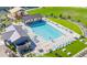 Aerial view of community pool with lounge area, shaded seating, and meticulously landscaped surroundings at 25202 N 142Nd Dr, Surprise, AZ 85387