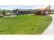 Community amenities include a playground, pool, and lush green space for recreation and leisure at 25202 N 142Nd Dr, Surprise, AZ 85387