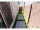Backyard features artificial grass, pavers, and a private space for outdoor relaxation and enjoyment at 25202 N 142Nd Dr, Surprise, AZ 85387