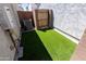 Backyard featuring artificial grass and a gate, ideal for small pets at 25202 N 142Nd Dr, Surprise, AZ 85387