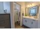 Bright bathroom featuring a vanity, shower, and natural light creating a clean and airy space at 25202 N 142Nd Dr, Surprise, AZ 85387