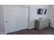Bedroom area with closet, dresser and dark colored carpet at 25202 N 142Nd Dr, Surprise, AZ 85387
