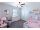 Charming Bedroom with a crib, dresser, and accent chair creating a cozy and inviting space at 25202 N 142Nd Dr, Surprise, AZ 85387
