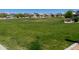 Expansive community green space, ideal for outdoor activities and relaxation with meticulously kept lawn at 25202 N 142Nd Dr, Surprise, AZ 85387