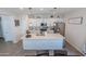 Modern kitchen showcasing white cabinetry, stainless steel appliances, and an island at 25202 N 142Nd Dr, Surprise, AZ 85387