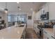 Well-appointed kitchen featuring an island, stainless steel appliances, and modern finishes at 25202 N 142Nd Dr, Surprise, AZ 85387