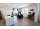 Open-concept kitchen with modern appliances, an island with seating, and a dining area at 25202 N 142Nd Dr, Surprise, AZ 85387