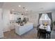 Bright kitchen with stainless steel appliances, spacious island, and adjacent dining area at 25202 N 142Nd Dr, Surprise, AZ 85387