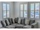 Close-up of gray sectional sofa and plantation shutters in the living room at 25202 N 142Nd Dr, Surprise, AZ 85387