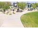 Community park featuring picnic areas and a well-maintained walking path for residents' enjoyment at 25202 N 142Nd Dr, Surprise, AZ 85387