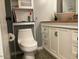 Bathroom vanity featuring a bowl sink and white cabinets at 2602 W Berridge Ln # C102, Phoenix, AZ 85017
